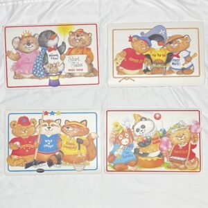 Shirt Tales - Lot of four 12x17” Laminated Placemats 1980s